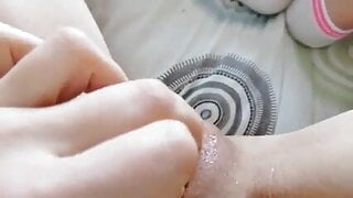 Girl masturbates in panties on the bed flowing juice from pu